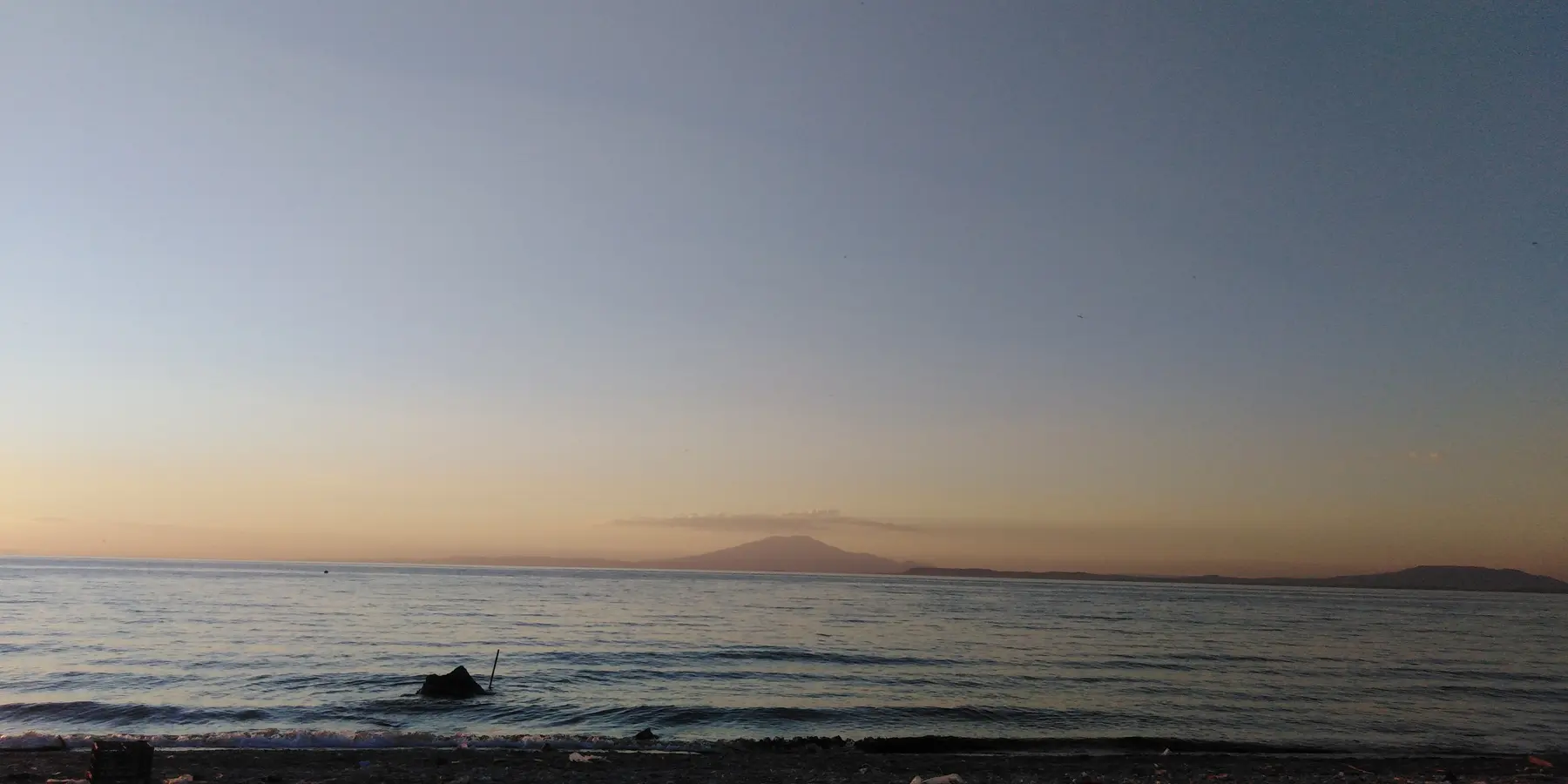 Lake Van at sunset with Mount Süphan in the distance, photographed from Edremit